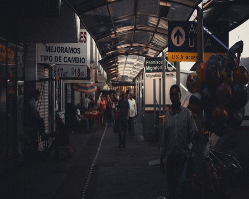 People walking dynamic but steady paths inside a well-lit urban transit station in Mexico